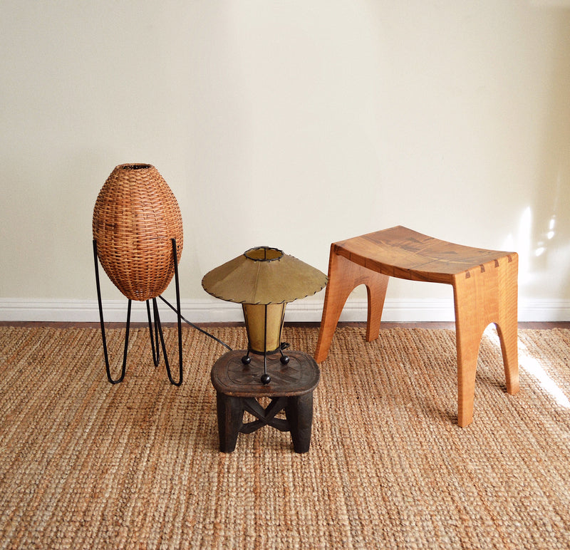 Hand carved solid wood African Nupe stool with vintage Mid Century lamps and stool