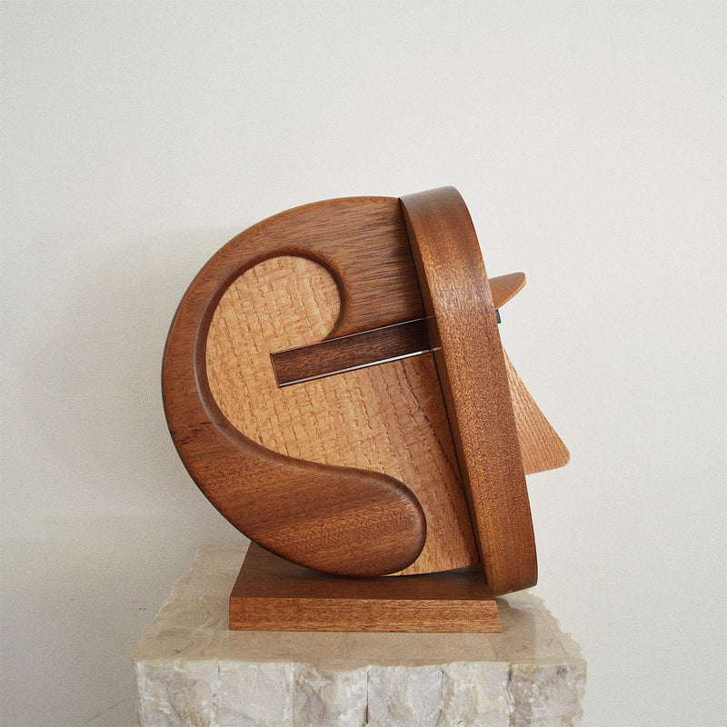 handcrafted oak, walnut, and ebony wood abstract face sculpture side view