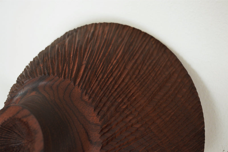 Close up view of textured hand carved cocobolo wood bowl by Al Stirt 