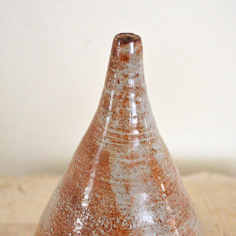 vintage cone shaped brown and grey bud vase close up of spout