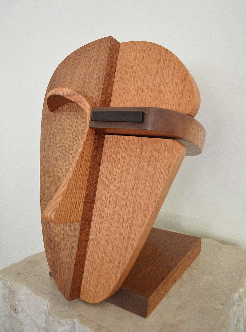 handcrafted oak, walnut, and ebony wood abstract face sculpture angled view