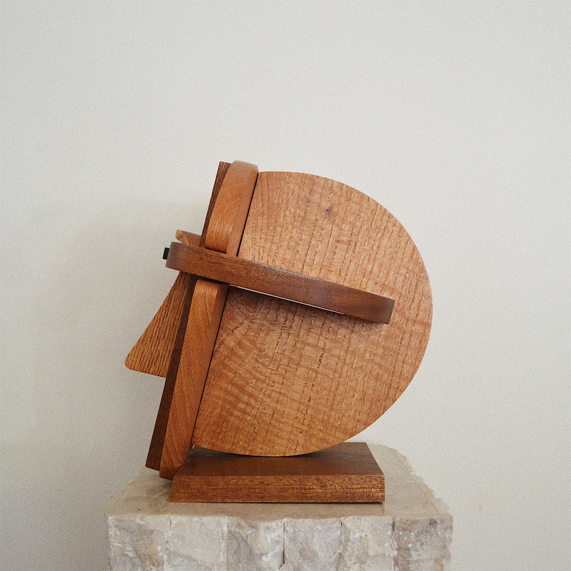 handcrafted oak, walnut, and ebony wood abstract face sculpture side view
