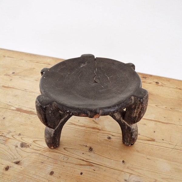 vintage hand carved three leg wood African Hehe stool top view