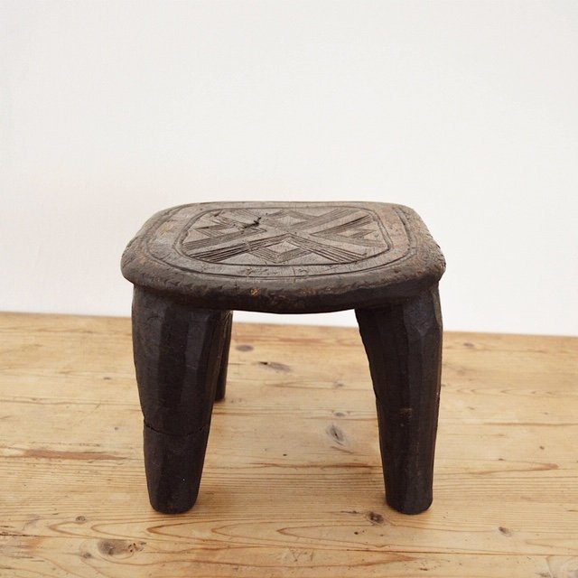 Hand carved solid wood African Nupe stool side view