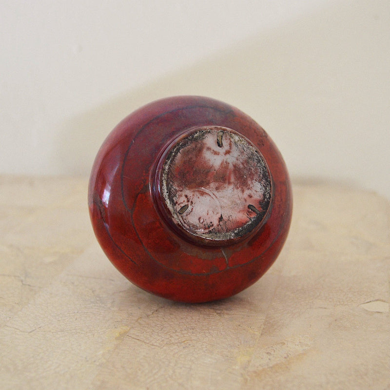 Handmade small red and grey Scandinavian pottery vase bottom view