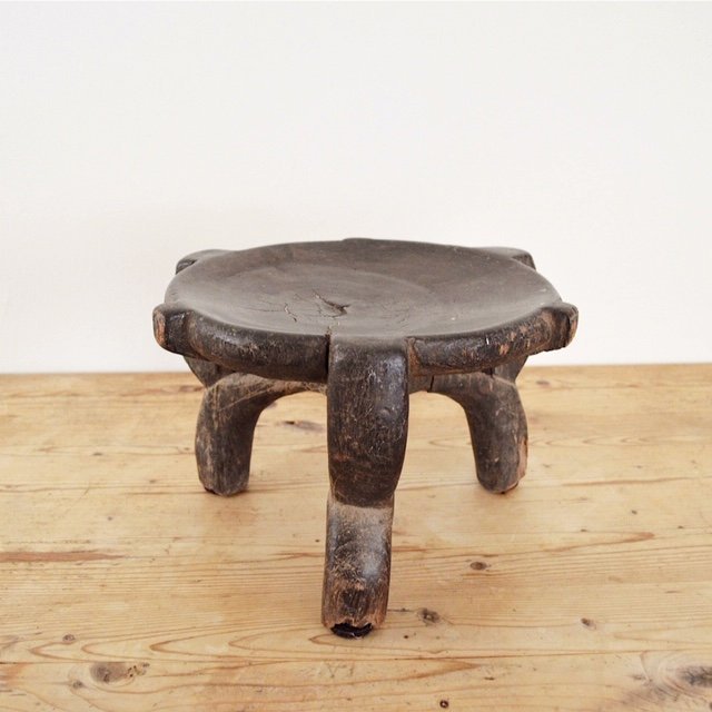 vintage hand carved three leg wood African Hehe stool side view
