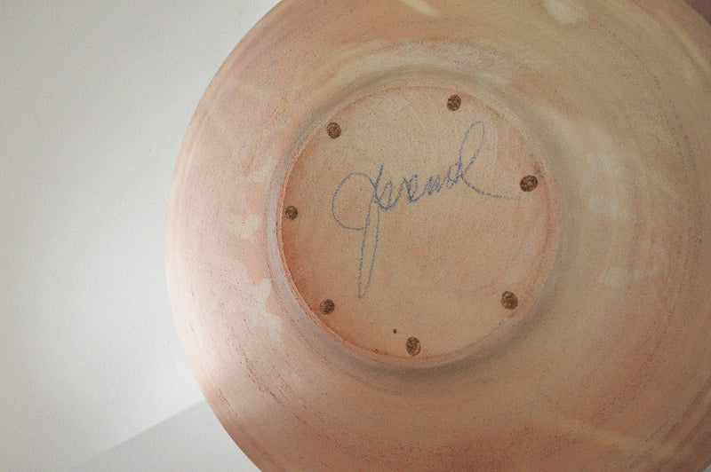 signature on the bottom of a monumental terracotta pottery vase